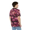 Pink pumpkins with carved faces and roses cover this all over print t-shirt, with a dark background and autumnal leaves.