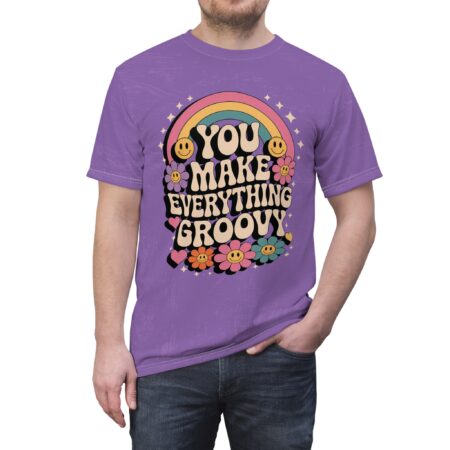 Purple t-shirt with "You Make Everything Groovy" retro graphic featuring smiley flowers, a rainbow, and stars.