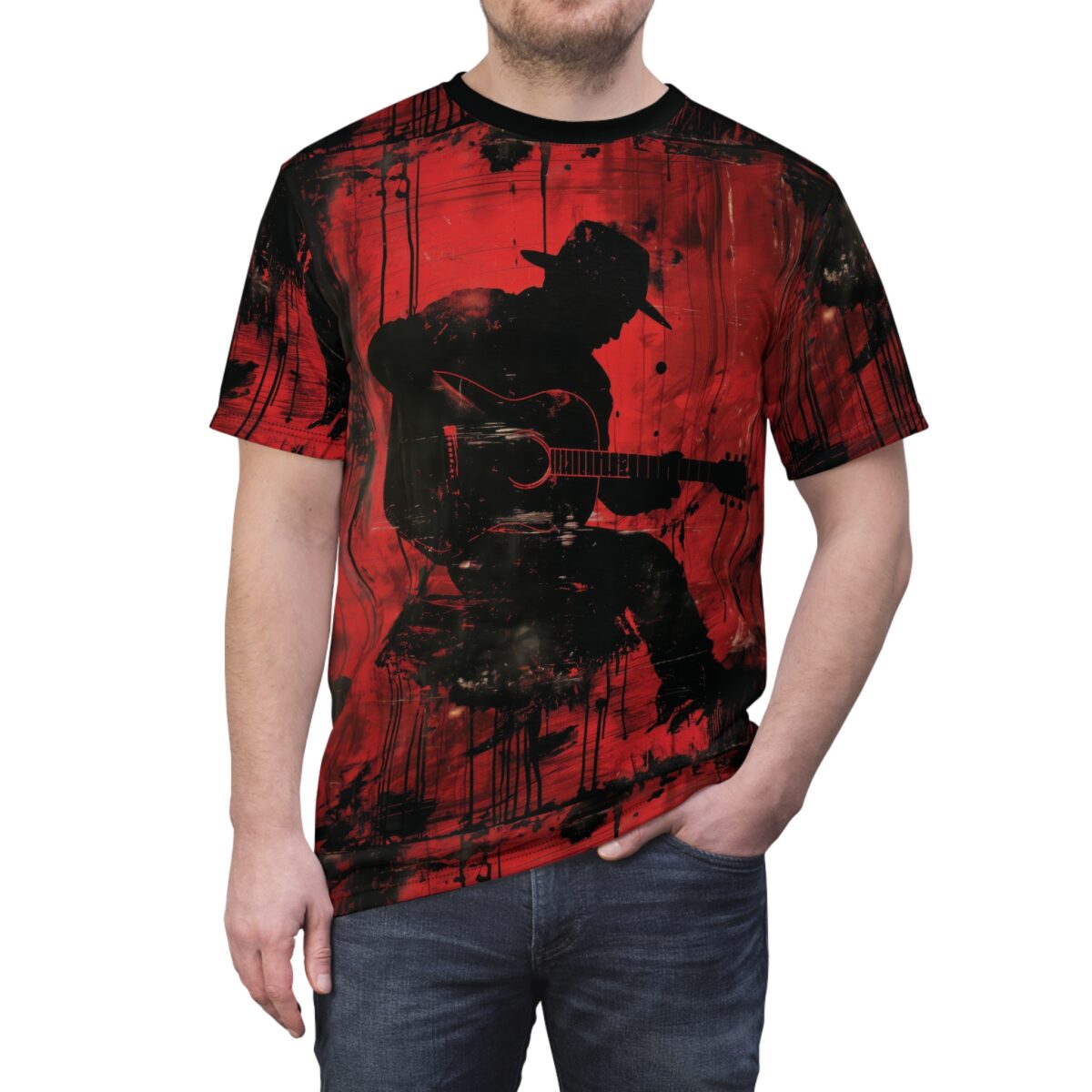 Red and black paint splatters and streaks cover this patterned tee shirt, with a black silhouette of a musician playing guitar.