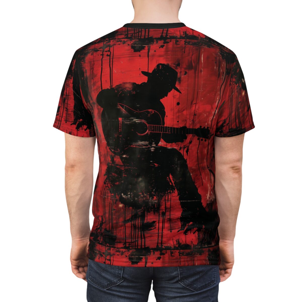 Back view of a red t-shirt featuring a black grunge silhouette of a cowboy playing a guitar.
