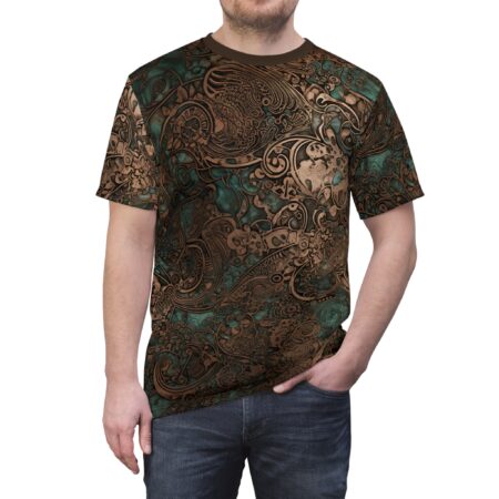 Intricate patterns in metallic bronze and deep teal cover this sublimation graphic tee, depicting swirling paisley shapes and stylized floral motifs.