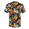 Black sublimation graphic tee, with a vibrant all-over print of stylized fall leaves in coral, cream, ochre, and teal.