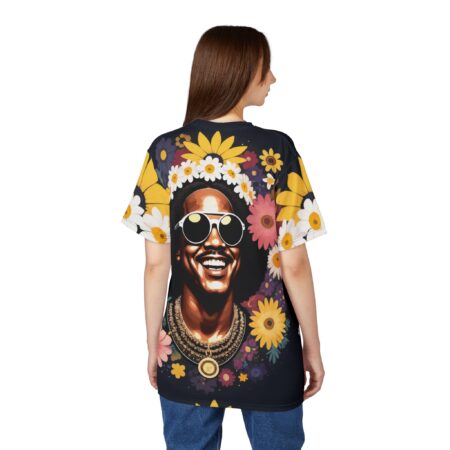 Yellow sunflowers, white daisies, and pink flowers cover this sublimation graphic tee, depicting a smiling man with sunglasses and a flower crown.