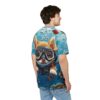 Back view of a person wearing a light blue t-shirt featuring a cute cartoon cat in scuba gear underwater with fish.
