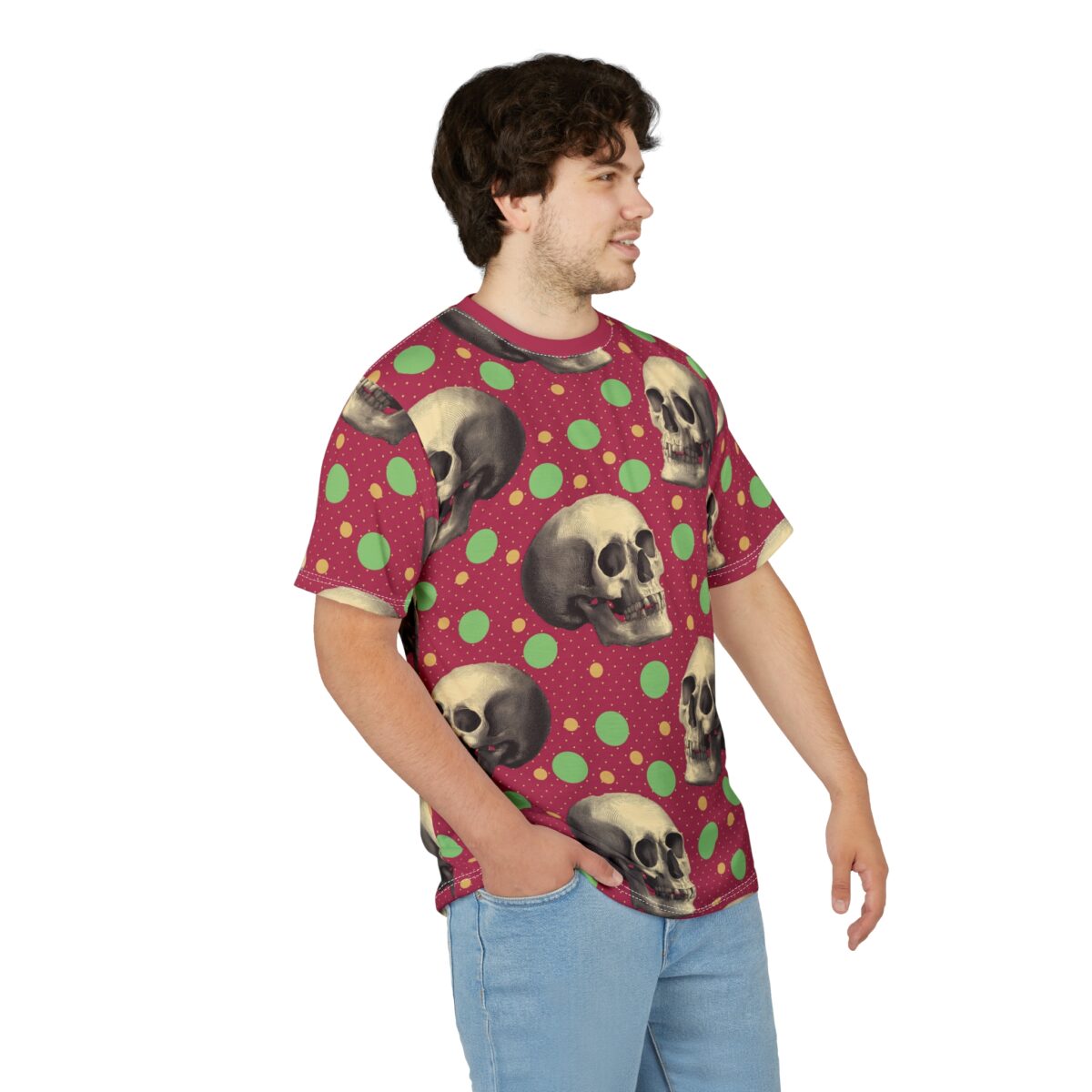 All over print sublimation tee featuring a vintage skull graphic with green and yellow polka dots on a maroon background.