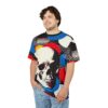 Bold red, blue, white, and yellow circles, along with black and white polka dots, surround a stark white skull design on this t-shirt.
