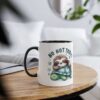 A white ceramic mug with a black rim and handle, featuring a cartoon sloth sleeping on a turtle with "NO NOT TODAY" text.