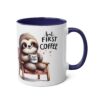 White ceramic mug with a navy blue handle and interior, featuring a watercolor illustration of a sloth holding a coffee cup.