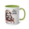 White ceramic mug with a green handle and interior, featuring a cartoon sloth holding a coffee cup with "first coffee" text.