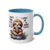 A white ceramic mug with a blue handle and rim, featuring a cartoon sloth holding a coffee cup.