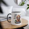 White ceramic mug with a black rim and handle, featuring a cute sloth graphic and text.