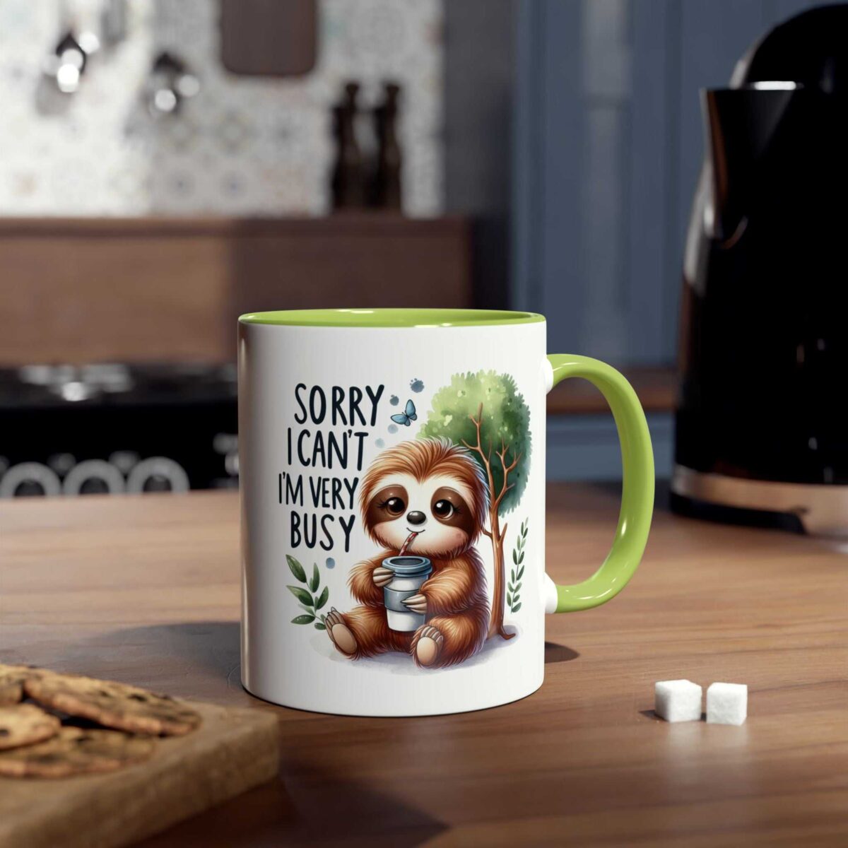 White ceramic mug with a lime green handle and rim, featuring a cartoon sloth drinking from a cup and the text "Sorry I Can't I'm Very Busy".