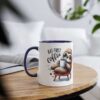A white mug with a navy blue rim and handle, featuring a cartoon sloth holding a coffee cup and the words "BUT FIRST coffee".