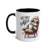 White ceramic mug with a black rim and handle, featuring a cartoon sloth in sunglasses relaxing in a chair with a coffee cup.