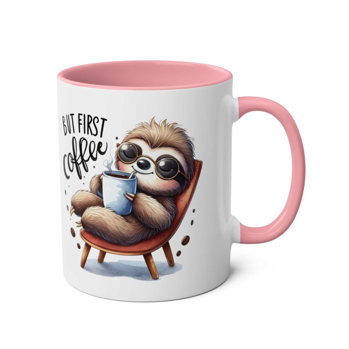 White mug with a pink handle and inner rim. Features a cute, fuzzy sloth wearing sunglasses, holding a coffee cup.