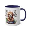 White ceramic mug with a blue interior and handle. Features a cute sloth on a rock, holding coffee.