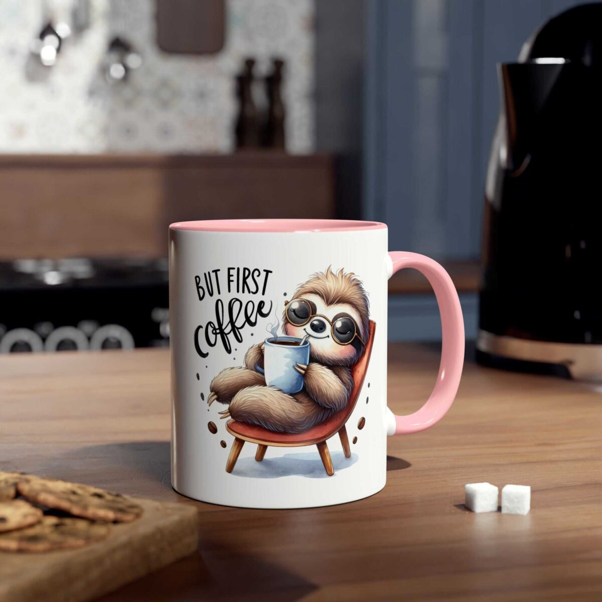 A white ceramic mug with a pink handle and rim, featuring a cartoon sloth enjoying coffee.