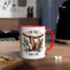 White ceramic mug with a red handle and rim, featuring a cartoon sloth hanging from a branch with leaves.