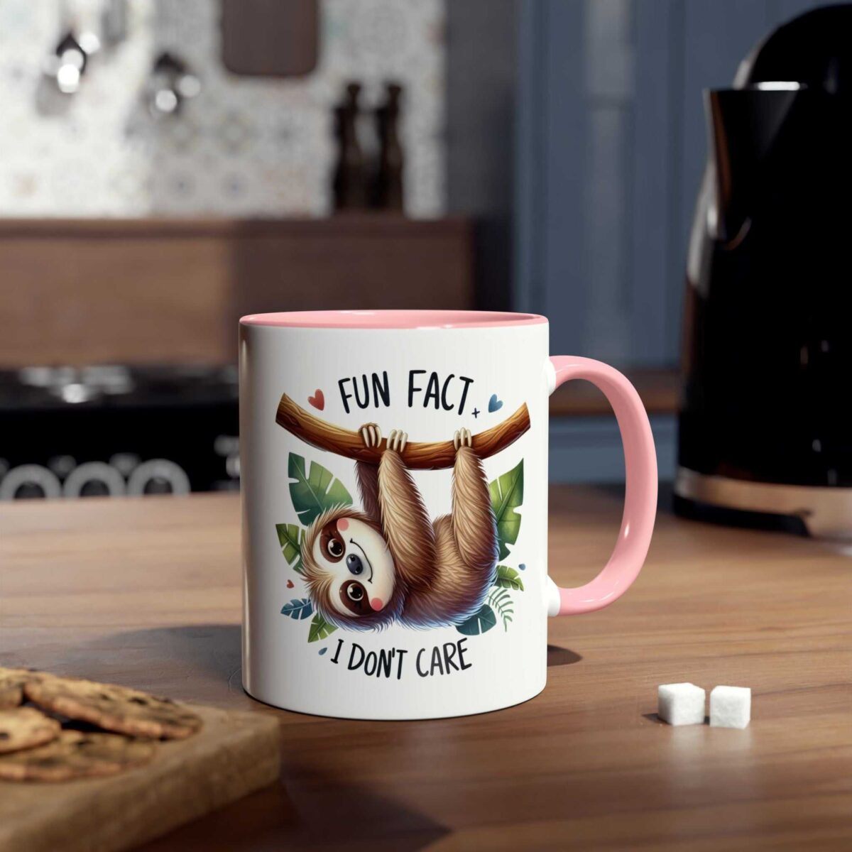 A white ceramic coffee mug with a pink rim and handle, featuring a sloth illustration.