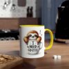 White coffee mug with a yellow handle, featuring a cute sloth peeking out of a coffee cup with "I NEED COFFEE" text.