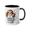 White mug with black rim and handle, featuring a cute sloth peeking out of a coffee cup with text "I NEED COFFEE".