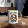 White ceramic mug with a cute sloth illustration, holding a polka dot mug, with "BUSY DOING NOTHING" text and a green handle.