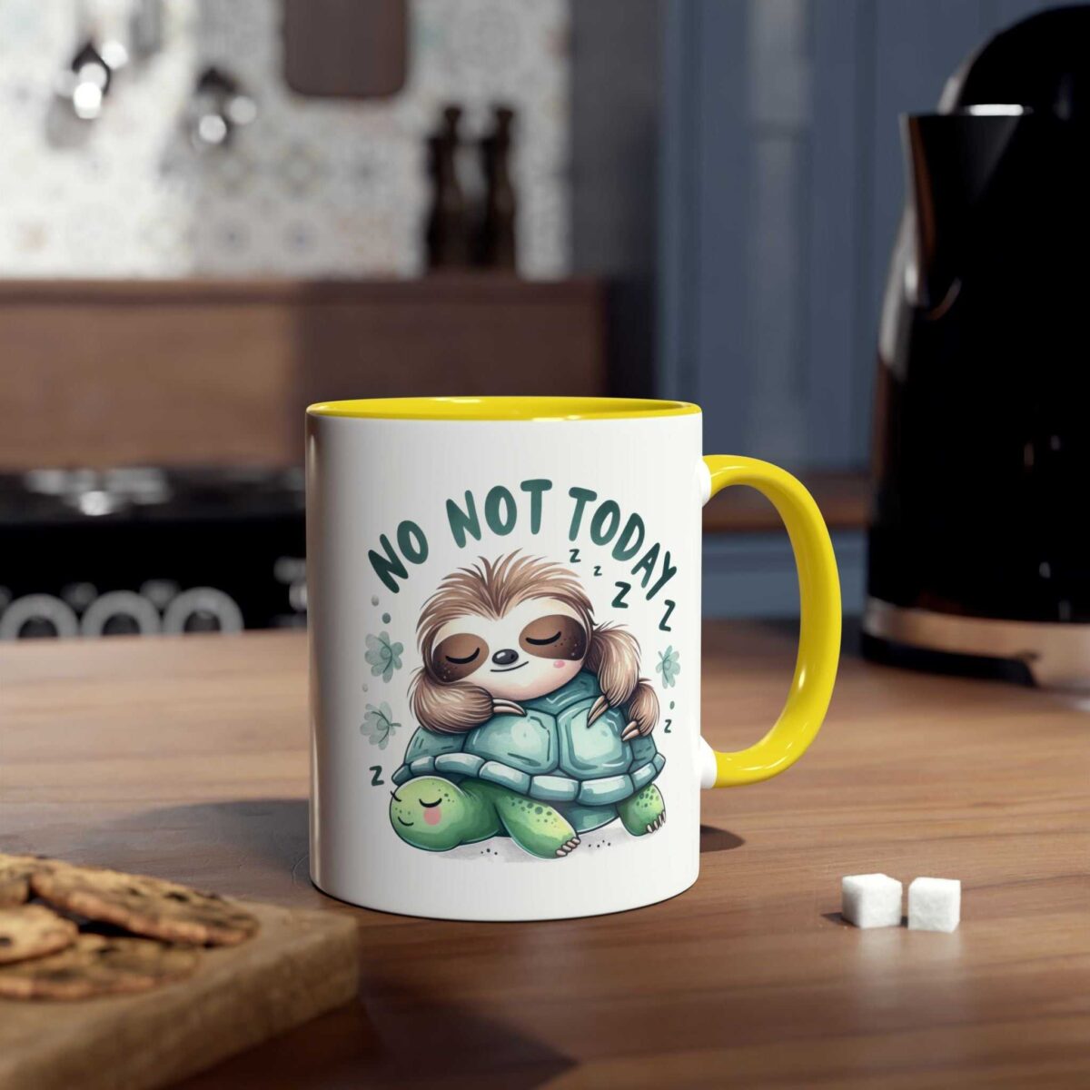White ceramic mug with a yellow handle, featuring a cute illustration of a sleeping sloth hugging a turtle.