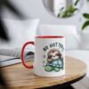 White mug with red handle and rim, featuring a cute sloth sleeping on a turtle.