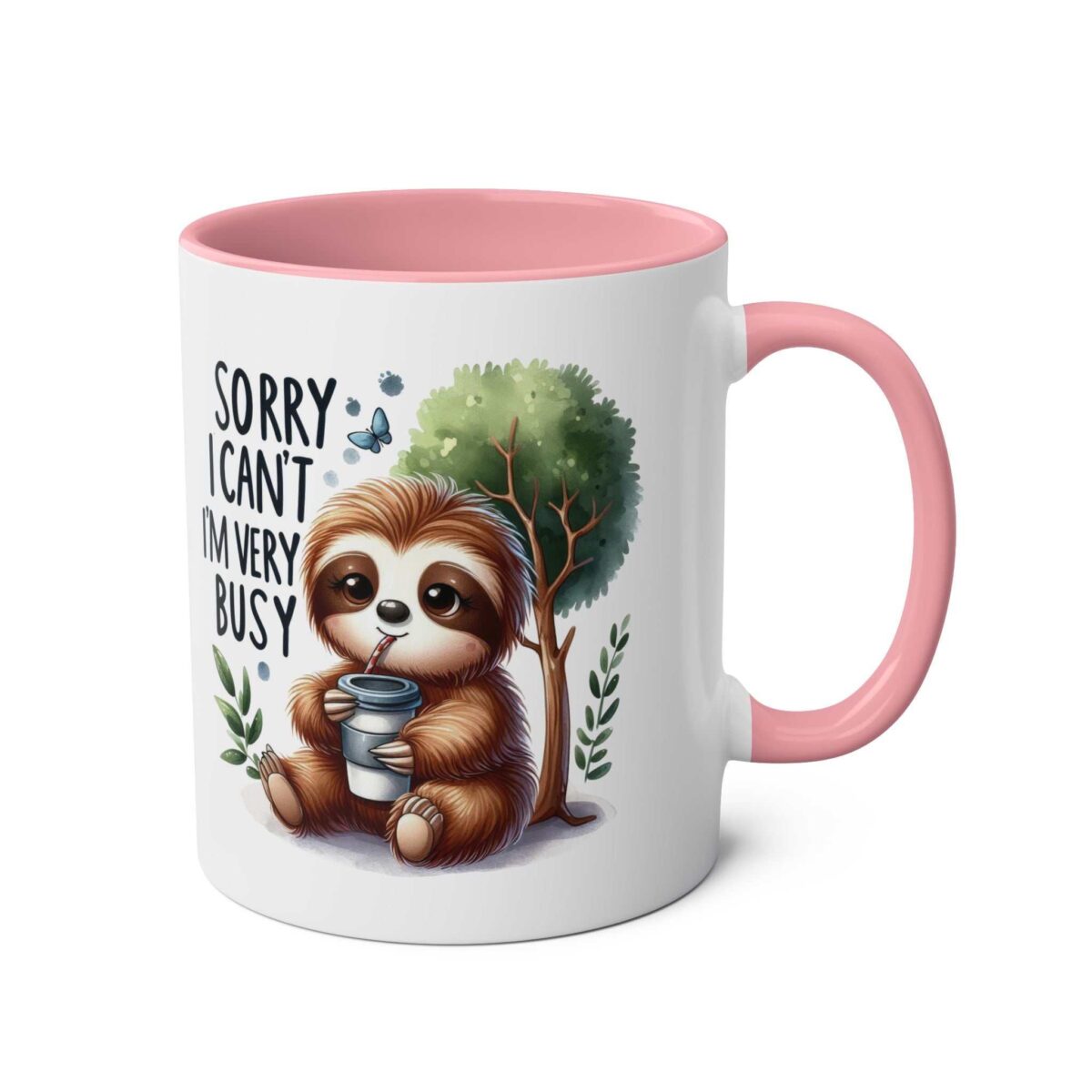 White ceramic mug with pink handle and interior, featuring a cute sloth holding a coffee cup and the text "SORRY I CAN'T IM VERY BUSY".