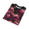 Pink and dark red roses, swirling vines, and grinning jack-o'-lanterns cover this full print shirt, set against a dark background.
