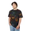 Glowing jack-o'-lanterns and falling leaves cover this oversized full print tee, set against a spooky, dark forest backdrop with glowing lanterns.