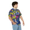 Colorful sublimation tee features a streetwear aesthetic with a vibrant all over print cartoon monster design.