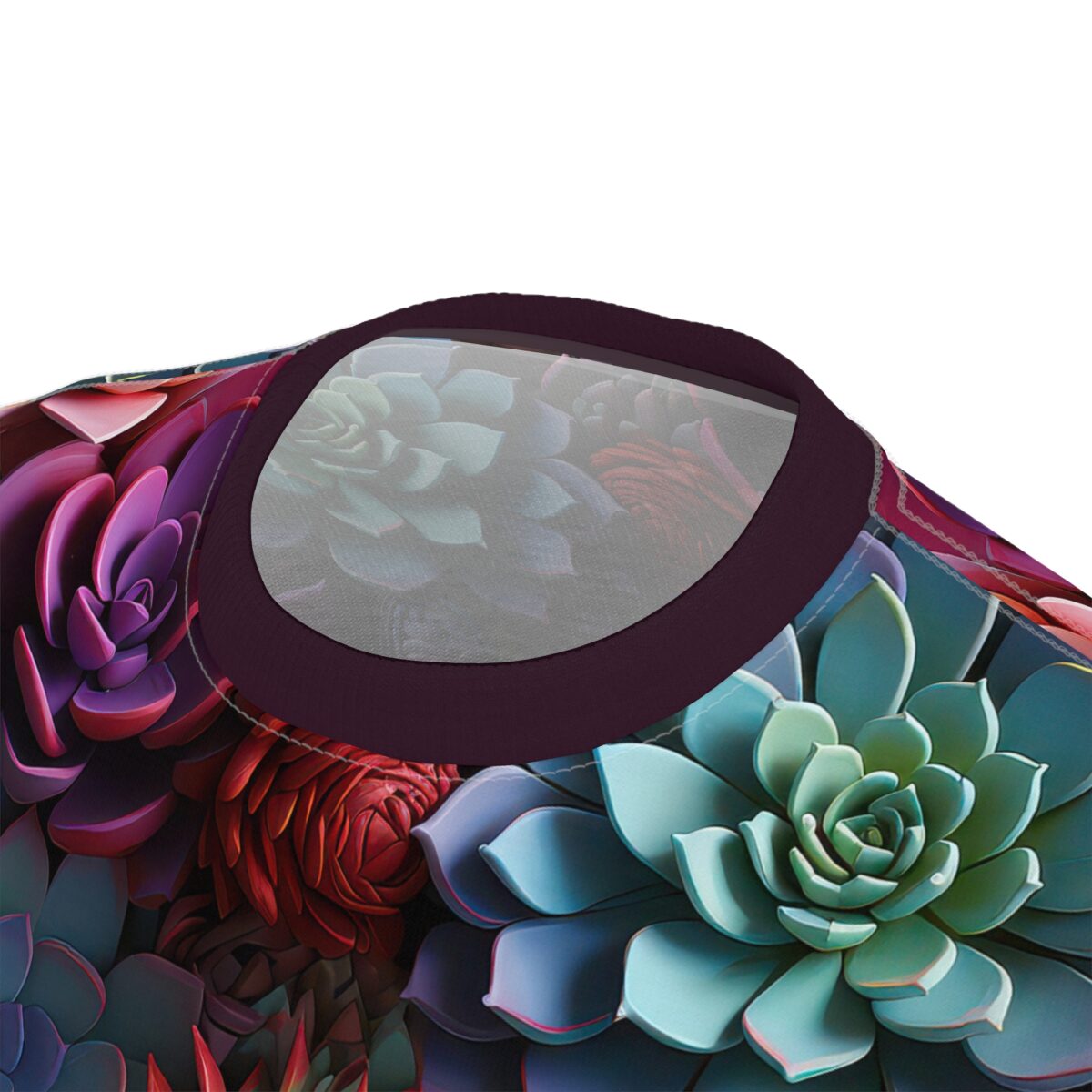 All over print sublimation tee showcasing a vibrant seamless pattern of colorful succulent flowers in shades of green, purple, and red.