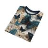 Teal and navy butterflies and cream flowers cover this all over print t-shirt, with intricate paper-like textures.