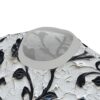 Black floral all over print t-shirt features a textured, paint-like pattern with bold black floral designs against a textured white background.