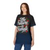 Red roses and green leaves form a wreath around white text reading "The Future is Female" on a gradient black to navy tee.