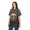 All over print sublimation tee featuring a surreal tree face with bright blue eyes and gnarled roots, set against a forest background.