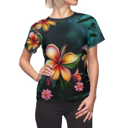 Tropical floral all over print sublimation tee, featuring hibiscus and plumeria flowers on a dark teal background.