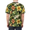 All over print t-shirt, vibrant tropical floral pattern, green leaves, orange hibiscus, yellow hibiscus, white lilies, black background.