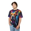 Vivid rainbow hues and abstract geometric shapes cover this sublimation graphic tee, depicting a striking canine portrait with intense eyes.