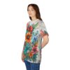 Vibrant all over print sublimation tee featuring an intricate floral design with orange, red, and blue flowers and green leaves.
