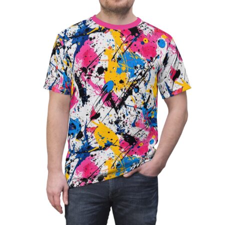 Crewneck t-shirt adorned with an energetic paint splatter design in pink, blue, yellow, and black on a white background.