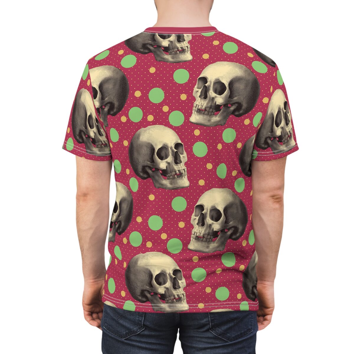 Vintage skulls and polka dots in green and yellow cover this all over print t-shirt, set against a deep red background.