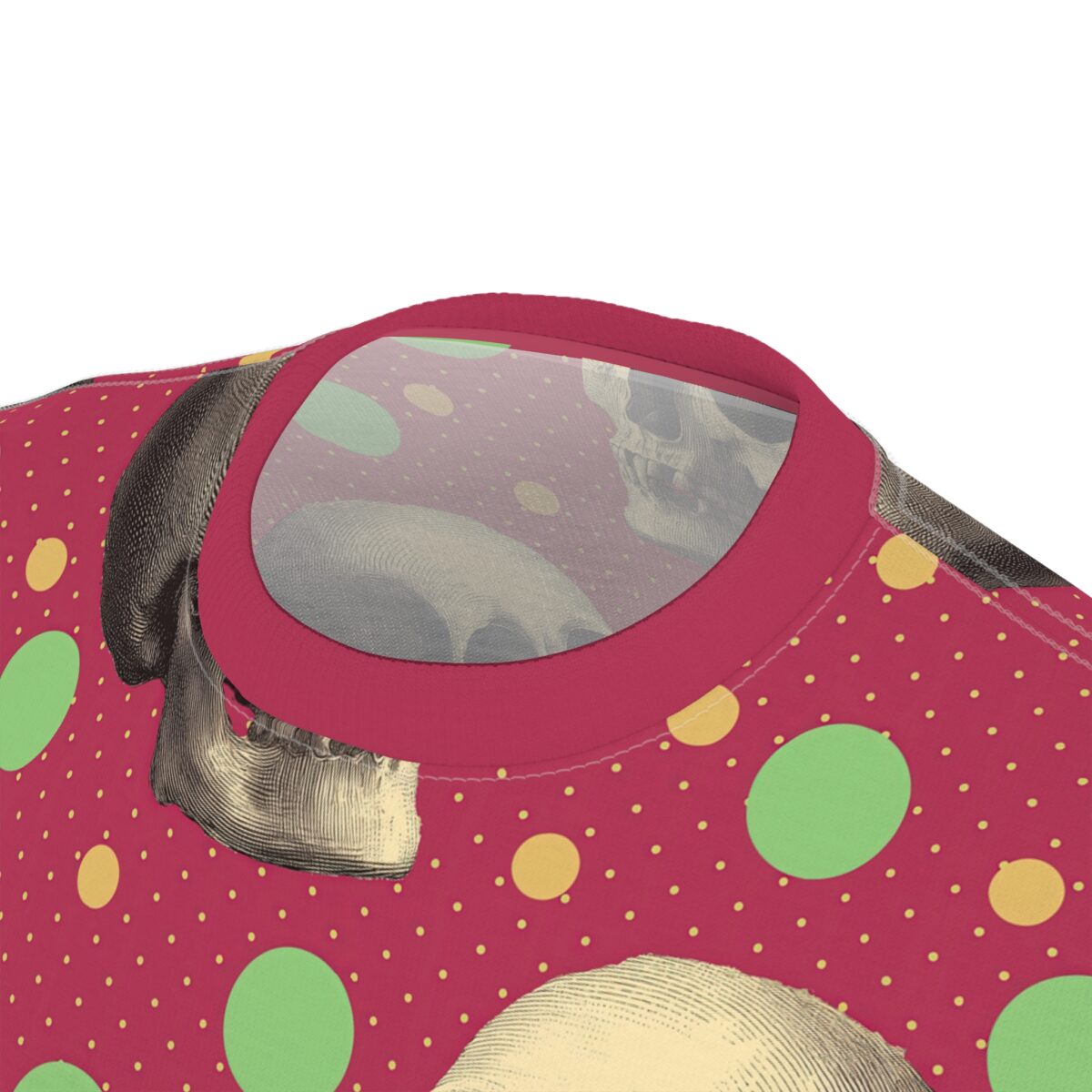 Red background with yellow and green polka dots, and detailed skull graphics cover this sublimation graphic tee.