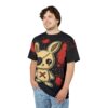 A man wearing a black t-shirt with a distressed voodoo-style cartoon bunny graphic, splattered with red ink.
