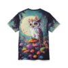Teal and dark blue clouds, a large moon, and a whimsical owl with flowers on its head sit amongst colorful mushrooms and pink flowers on this tee.