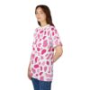 White crewneck t-shirt with an all-over abstract pattern of irregular pink and deep pink shapes.