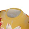 Yellow sublimation tee with a vibrant all over print of red and white lilies. Features a seamless wrap around graphic.