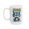 White ceramic mug with a grumpy blue cat illustration and text.