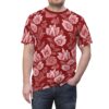 Red t-shirt with detailed white and pink vintage rose patterns covering it.